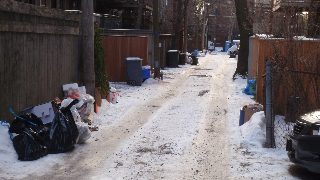 alley in snow and trash